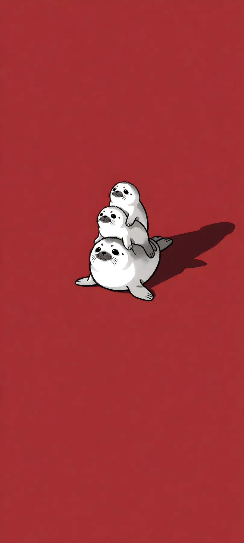 three stacked seal pups